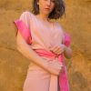 woman wearing traditional silk pink wrap dress