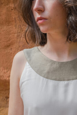 woman wearing white silk top detail